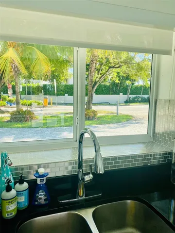 a view of a floor to ceiling window in an empty room