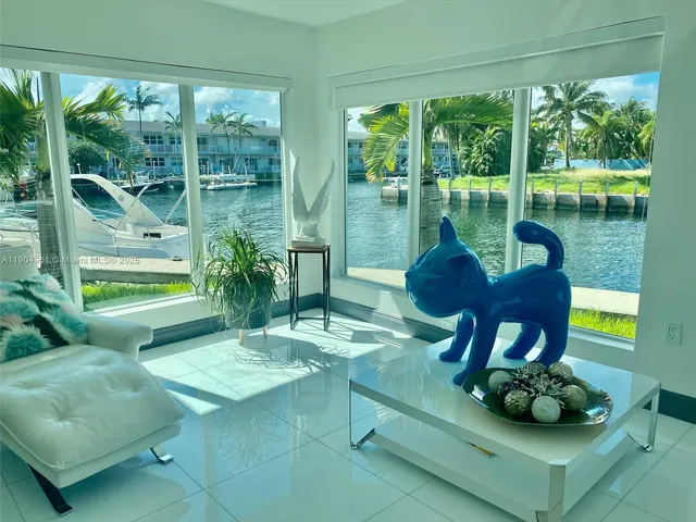 a room with pool table and chairs