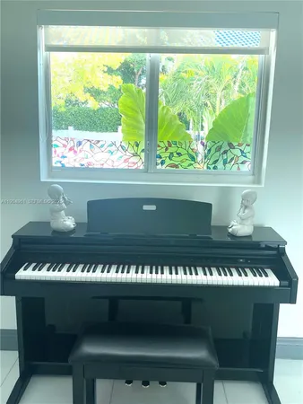 a view of a house with pool and chairs