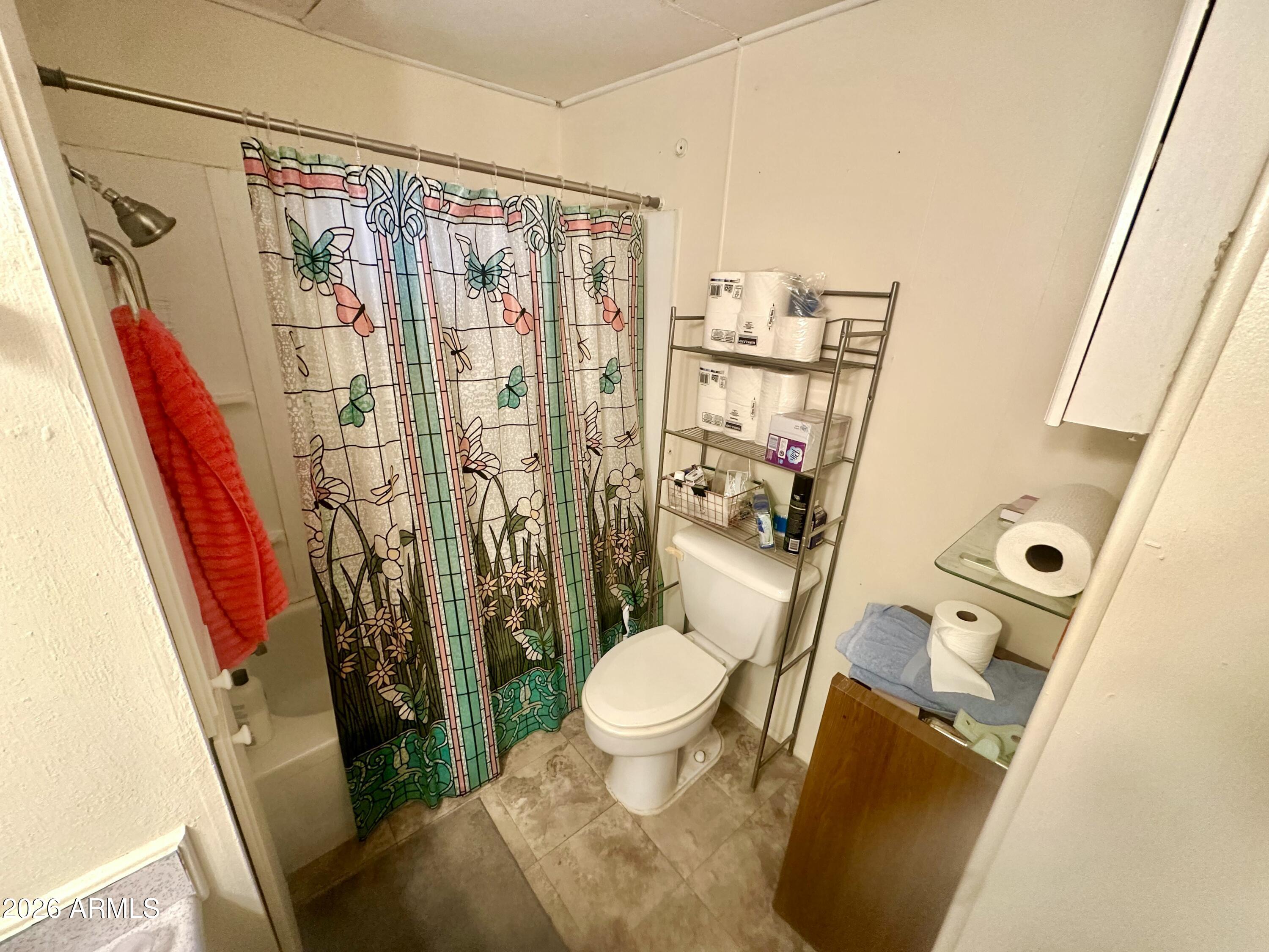 17412 East Trails End Road Mayer, AZ 86333 - Photo 21 of 28 a bathroom with a granite countertop sink toilet and shower