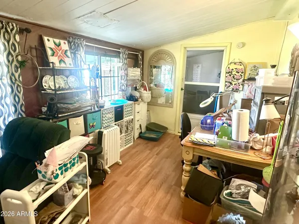 a living room with furniture a fireplace and a floor to ceiling window