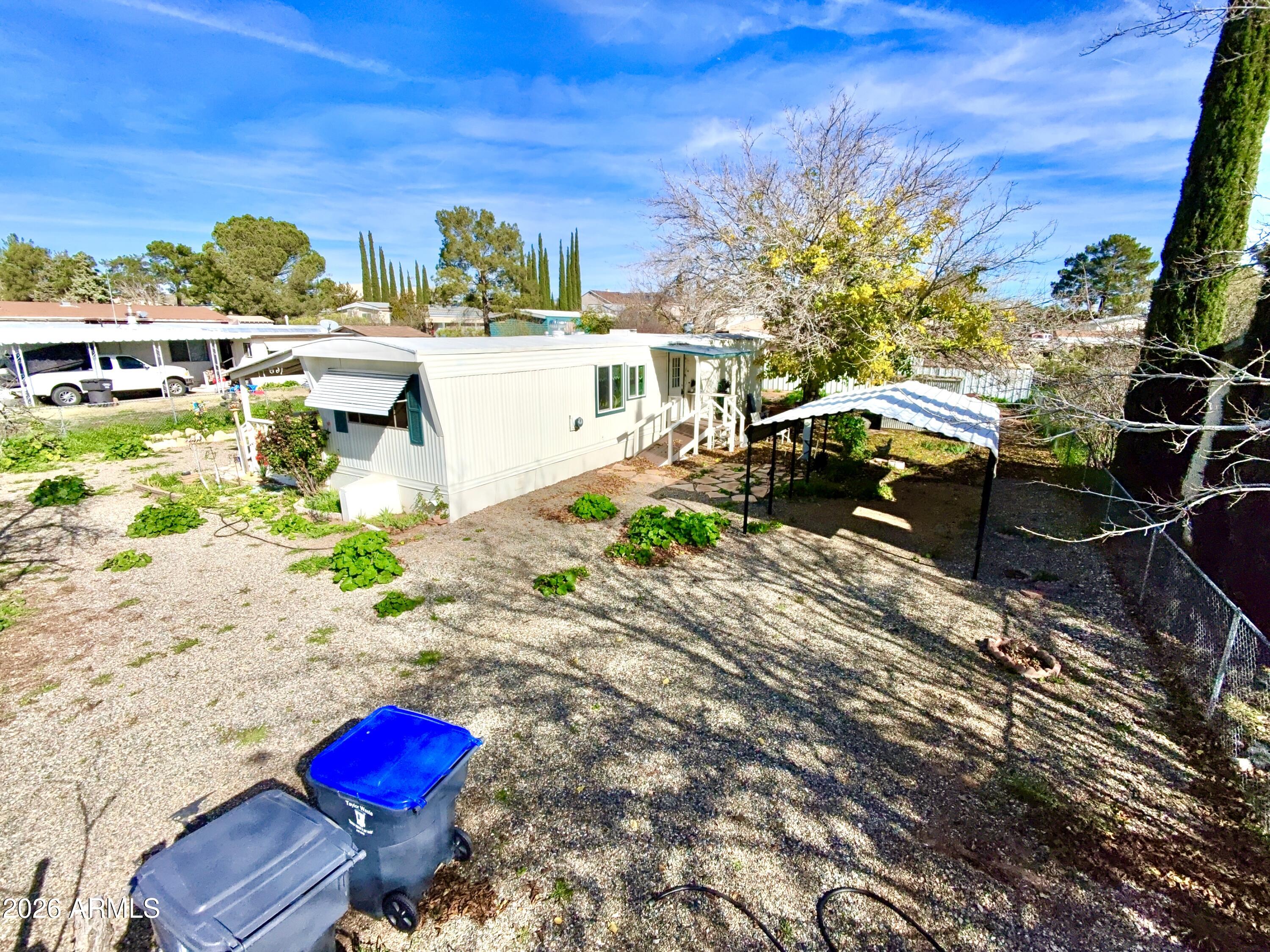 17412 East Trails End Road Mayer, AZ 86333 - Photo 4 of 28 a view of a chairs and table in a patio