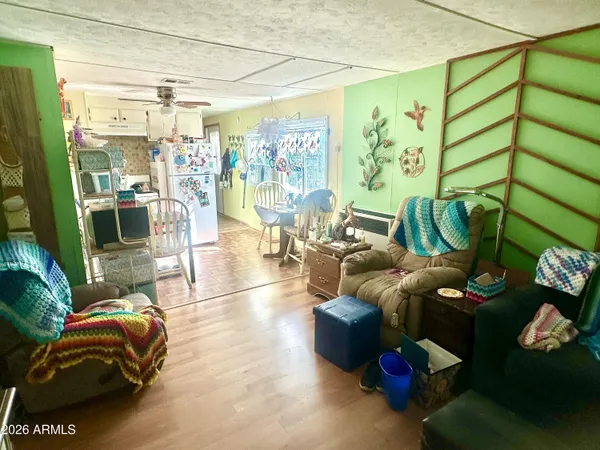 a living room with furniture and floor to ceiling window