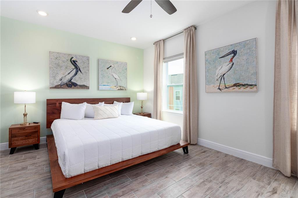 2960 On The Rocks Point Kissimmee, FL 34747 - Photo 11 of 17 a bedroom with bed and painting on the wall