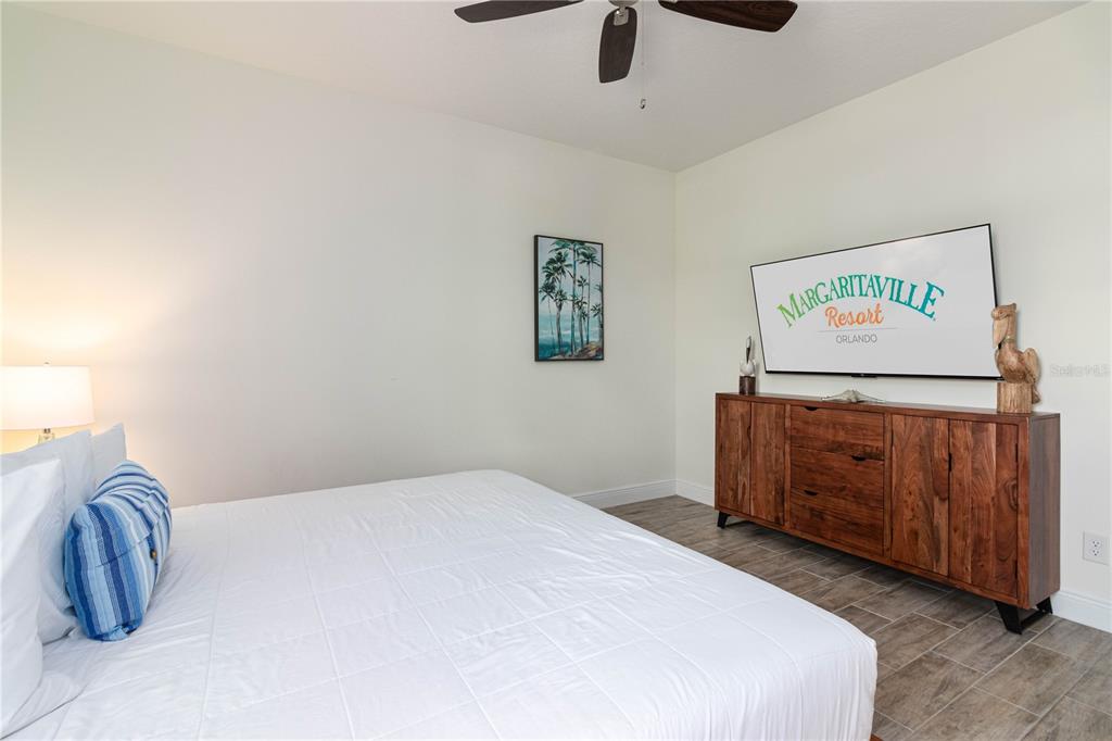 2960 On The Rocks Point Kissimmee, FL 34747 - Photo 15 of 17 a bedroom with a bed and cabinets