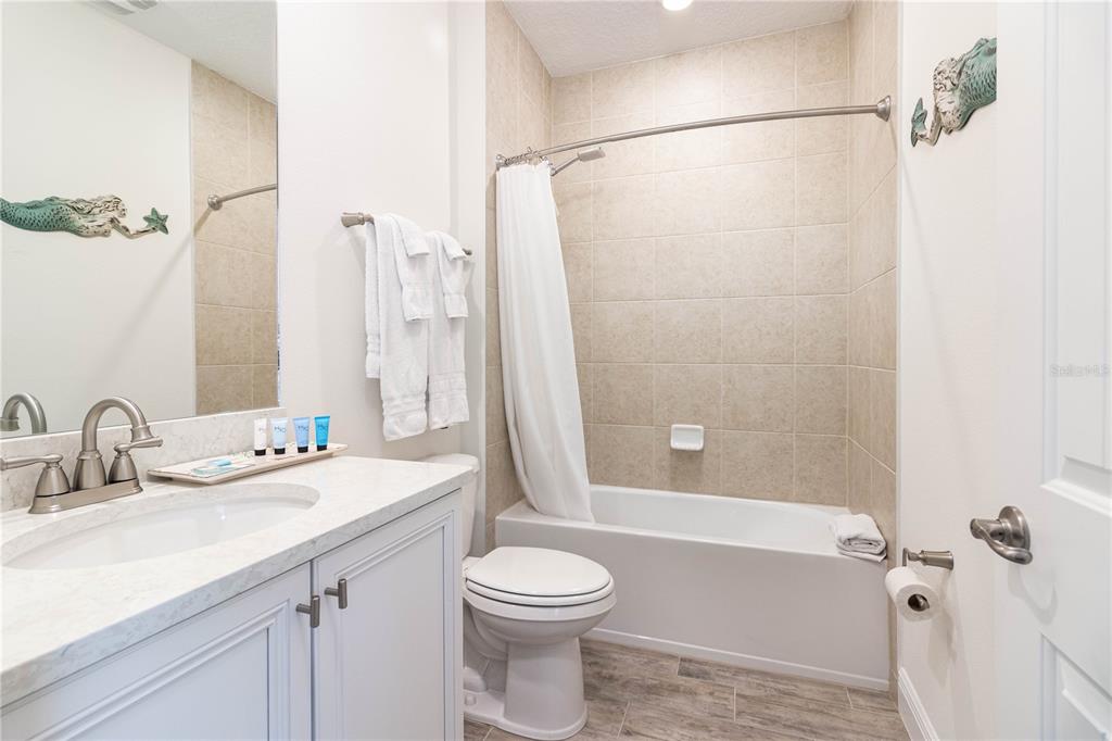 2960 On The Rocks Point Kissimmee, FL 34747 - Photo 16 of 17 a bathroom with a sink a toilet and shower