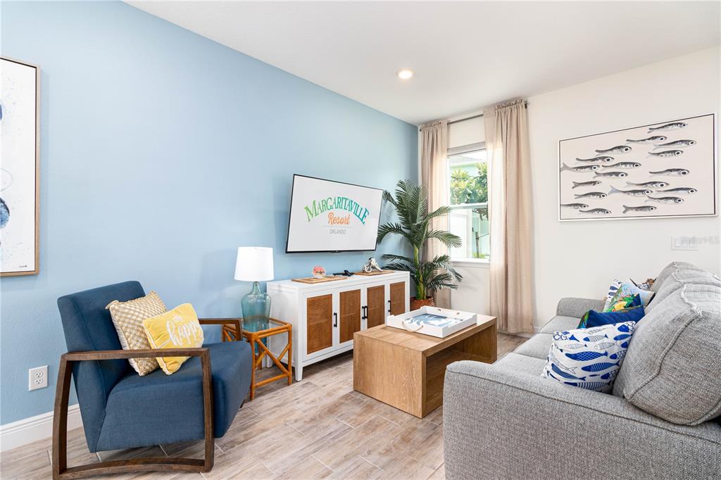 2960 On The Rocks Point Kissimmee, FL 34747 - Photo 4 of 17 a living room with furniture and a large window