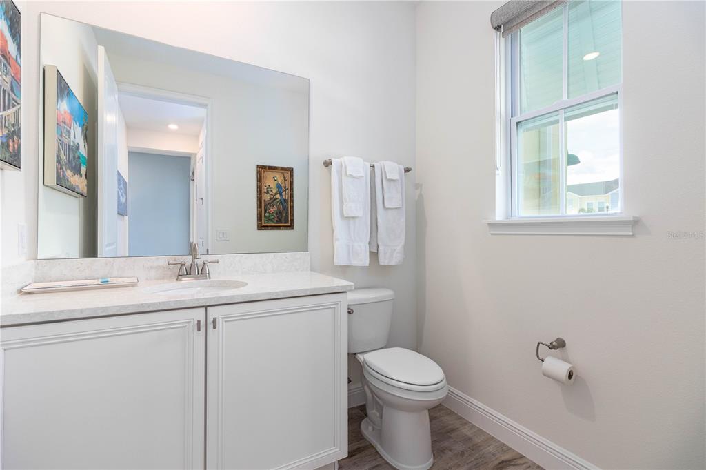 2960 On The Rocks Point Kissimmee, FL 34747 - Photo 9 of 17 a bathroom with a toilet sink and mirror