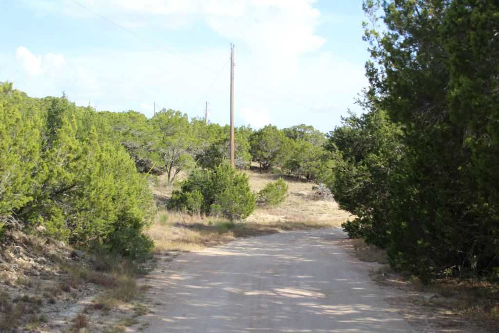 28808 Rim Rock Road Marble Falls, TX 78654 - Photo 9 of 15 Lower roadway to the Lots at power pole