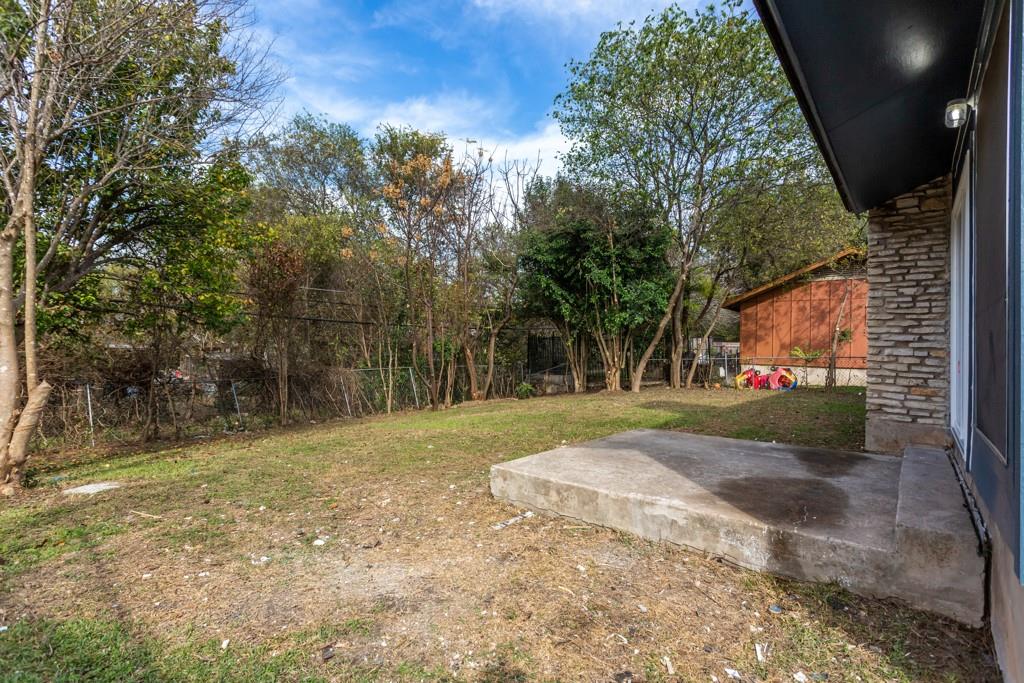 9604 Crown Ridge Road Austin, TX 78753 - Photo 23 of 24 A spacious backyard with mature trees provides ample room for outdoor activities.