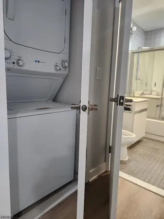 a view of closet with wooden floor