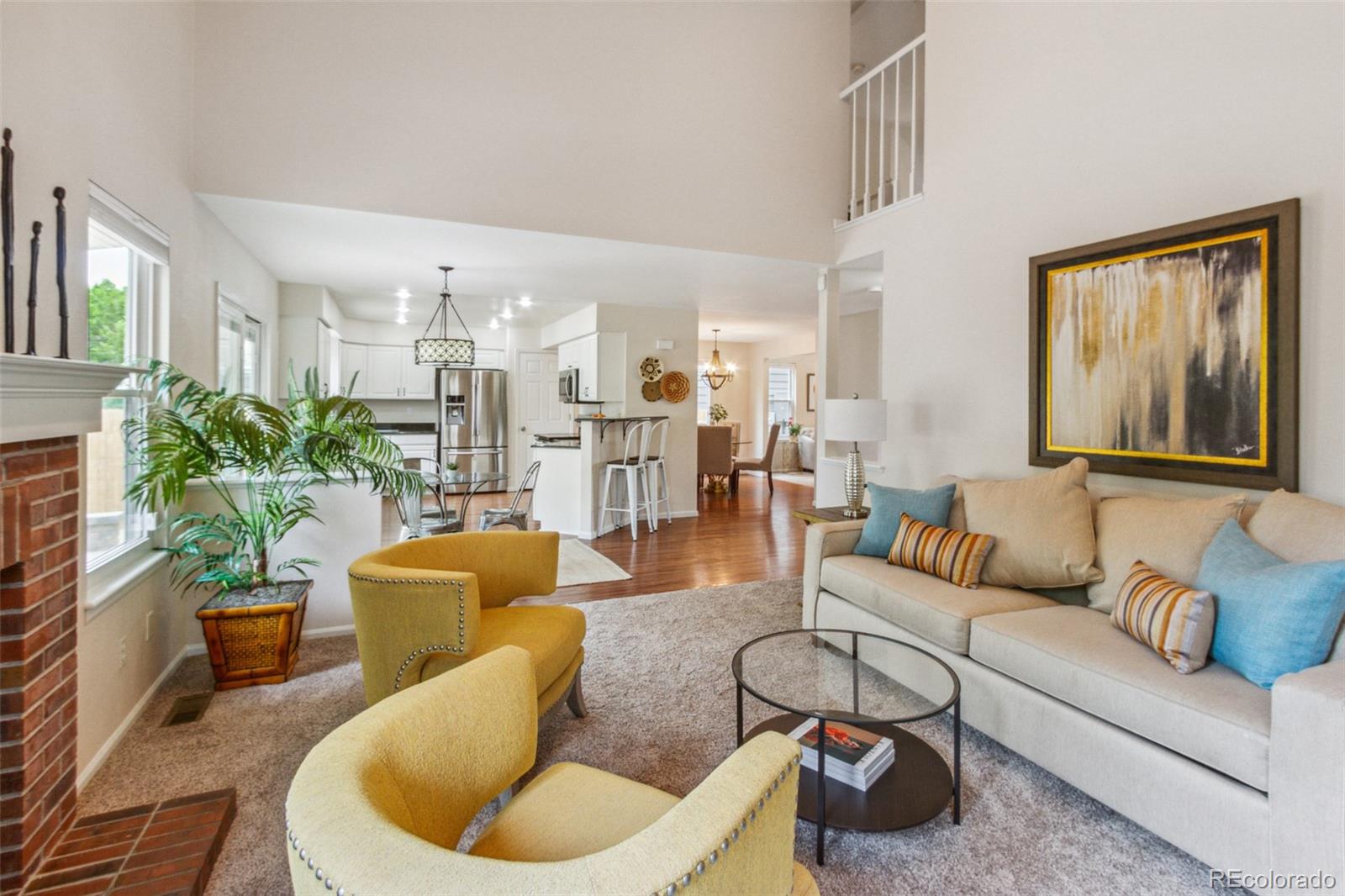2975 East 133rd Circle Thornton, CO 80241 - Photo 14 of 29 a living room with furniture and a potted plant