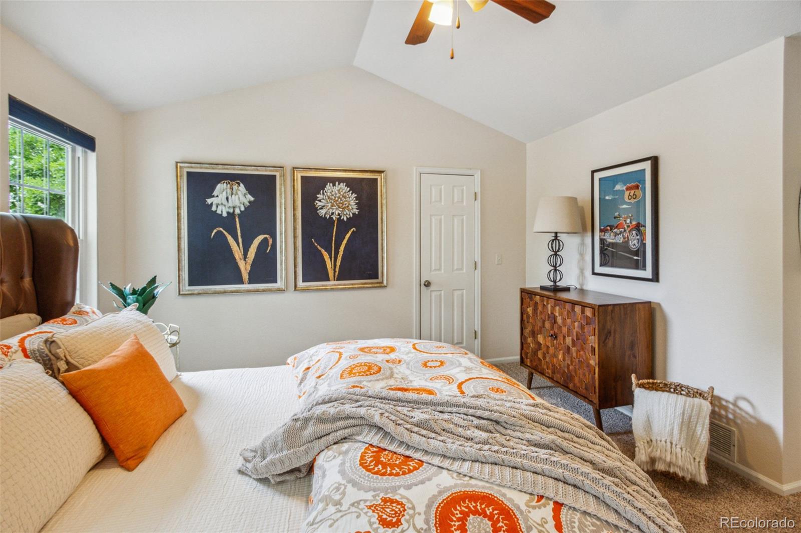 2975 East 133rd Circle Thornton, CO 80241 - Photo 19 of 29 a bedroom with a bed and a couch