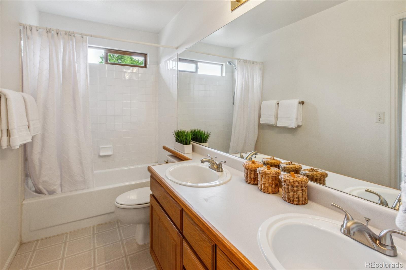 2975 East 133rd Circle Thornton, CO 80241 - Photo 25 of 29 a bathroom with a sink toilet and shower