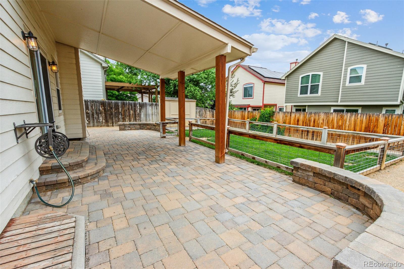 2975 East 133rd Circle Thornton, CO 80241 - Photo 26 of 29 a view of a house with backyard and porch