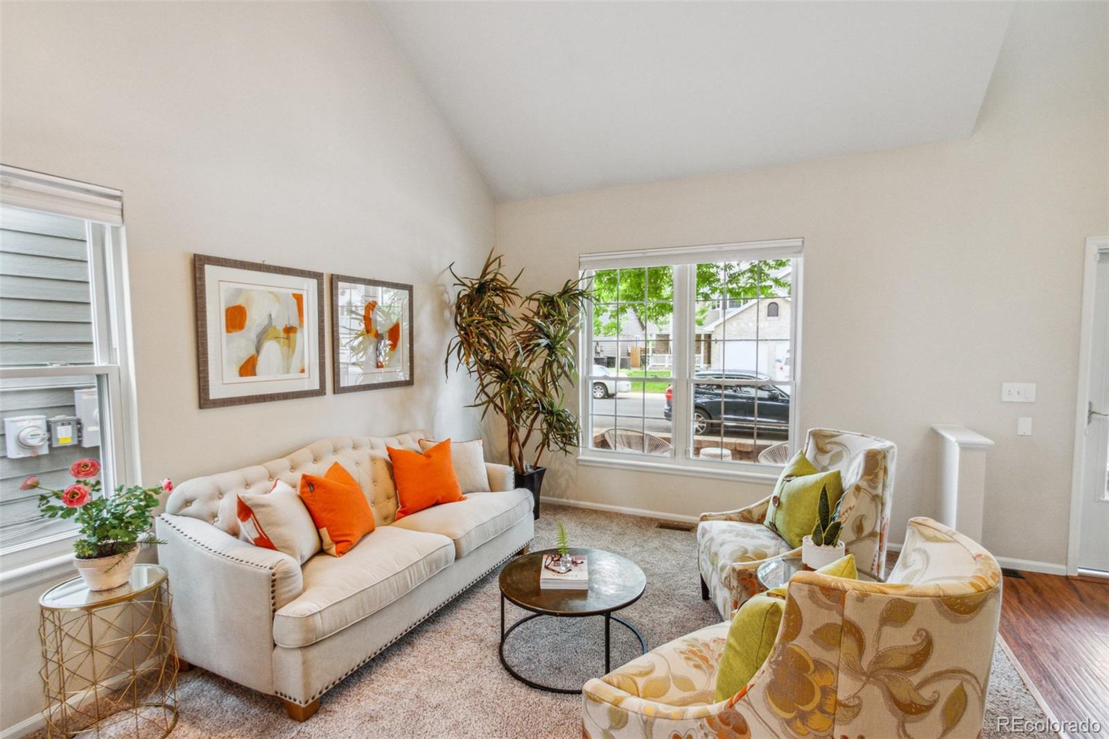 2975 East 133rd Circle Thornton, CO 80241 - Photo 6 of 29 a living room with furniture and a large window