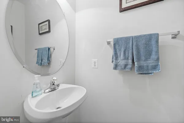 a bathroom with a sink and mirror