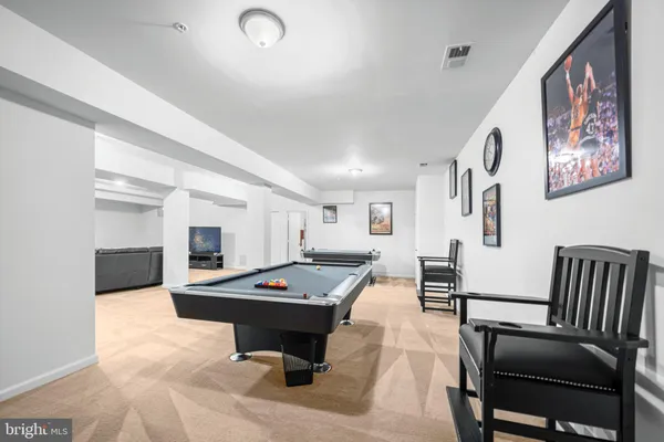 a kitchen with a table and chairs in it