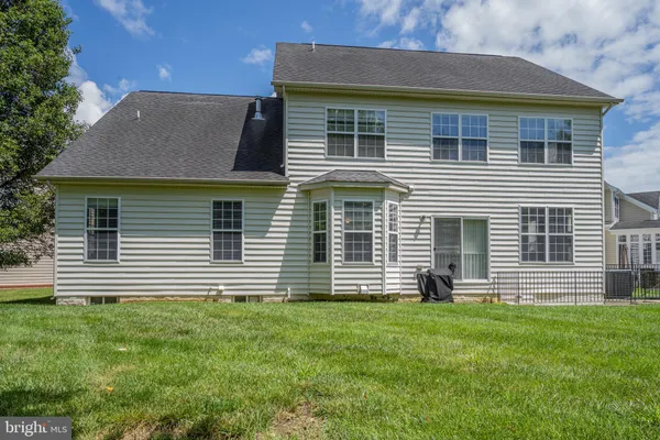 a view of a big yard with large trees