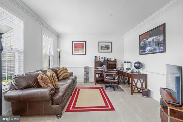 a living room with furniture or couch and a flat screen tv