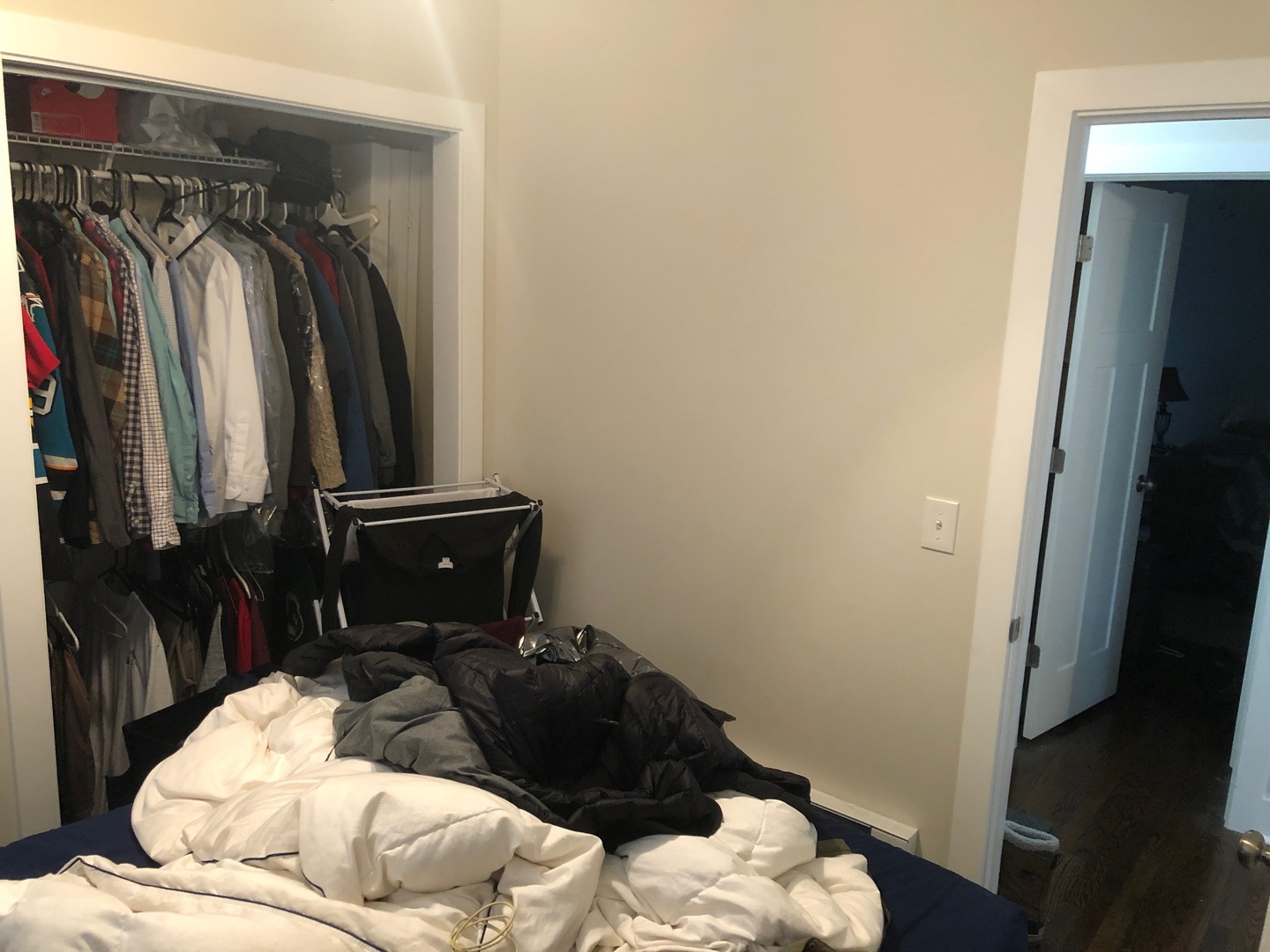 839 West Cornelia Avenue, Unit 3N Chicago, IL 60657 - Photo 6 of 7 a bedroom with a bed and a mirror