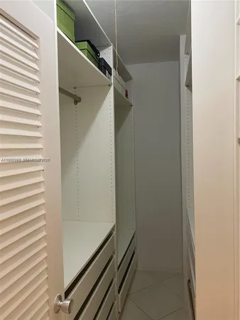 a bathroom with a glass door shower