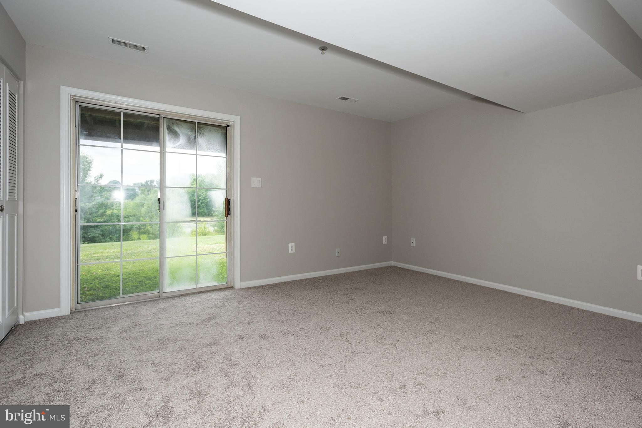 5505 Oberlin Place Frederick, MD 21703 - Photo 4 of 39 Lower level bedroom/rec room