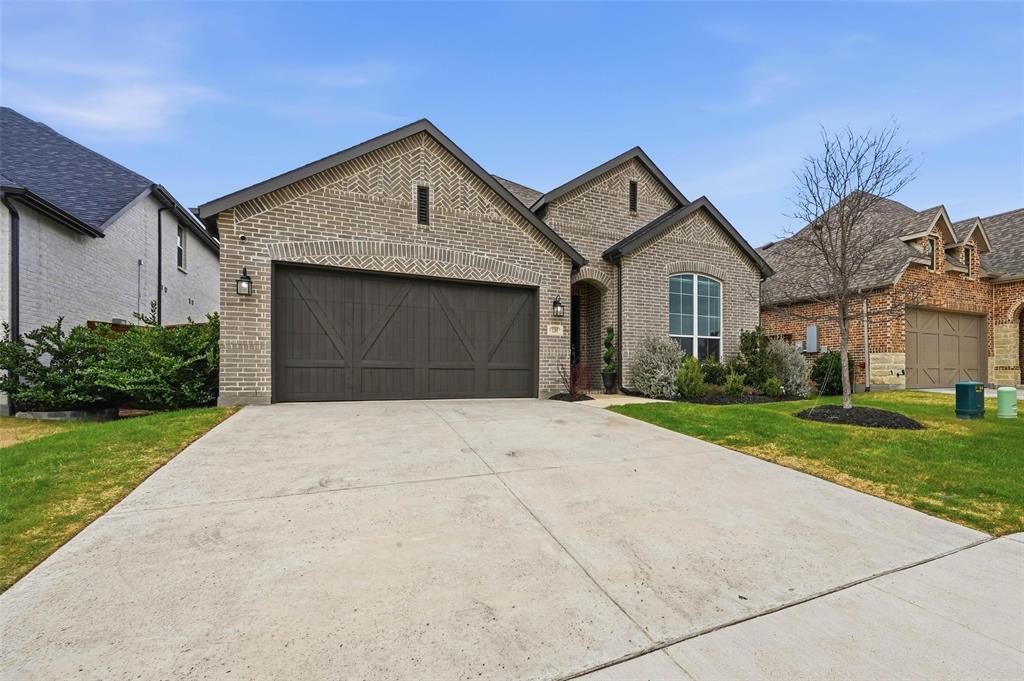 1205 Roundwash Way Midlothian, TX 76065 - Photo 1 of 38 a front view of a house with a yard and garage