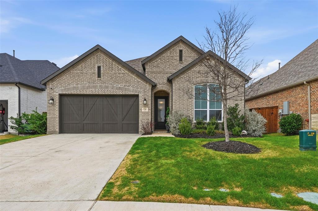 1205 Roundwash Way Midlothian, TX 76065 - Photo 2 of 38 a front view of a house with a yard and garage