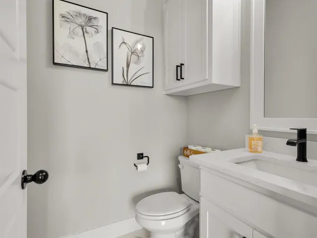 a bathroom with a toilet and a sink