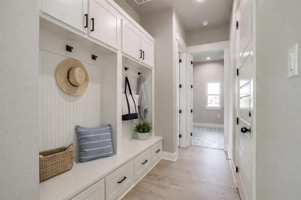 650 Winkler Way Springtown, TX 76082 - Photo 23 of 30 a spacious bathroom with a shower a sink and a mirror