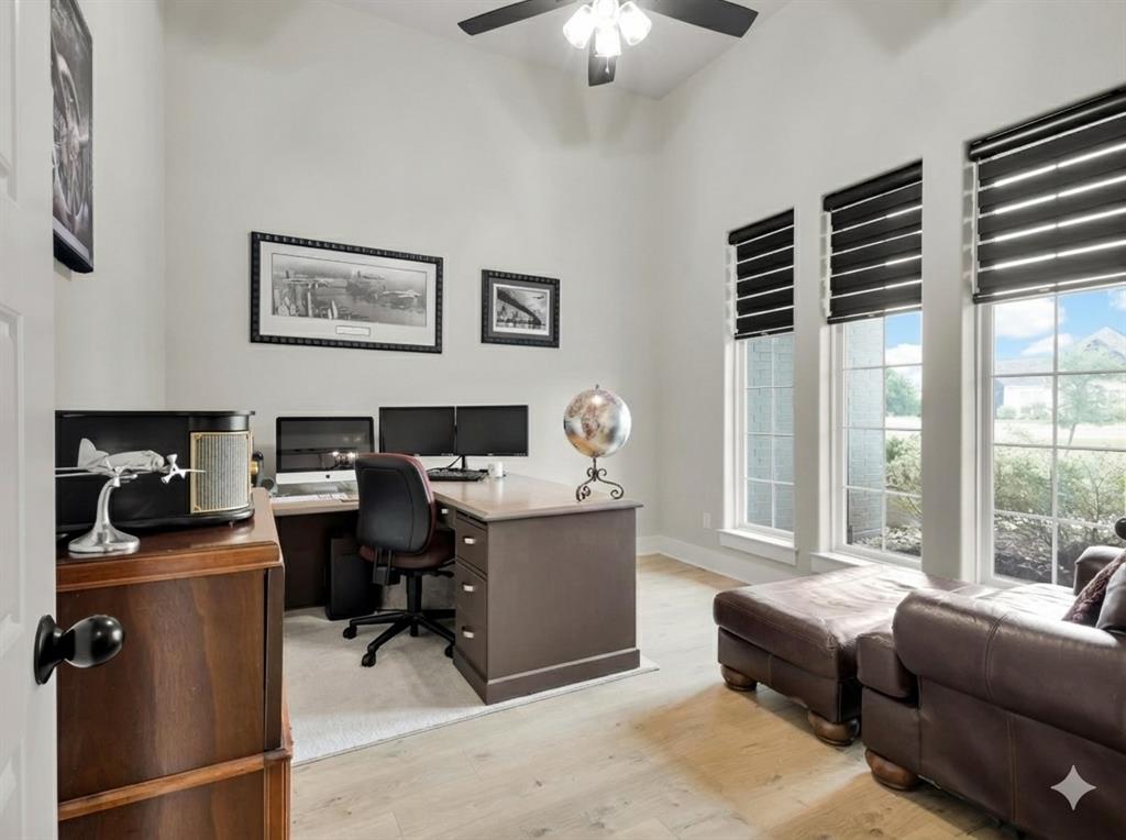 650 Winkler Way Springtown, TX 76082 - Photo 3 of 27 a view of a workspace with a window and lounge chair