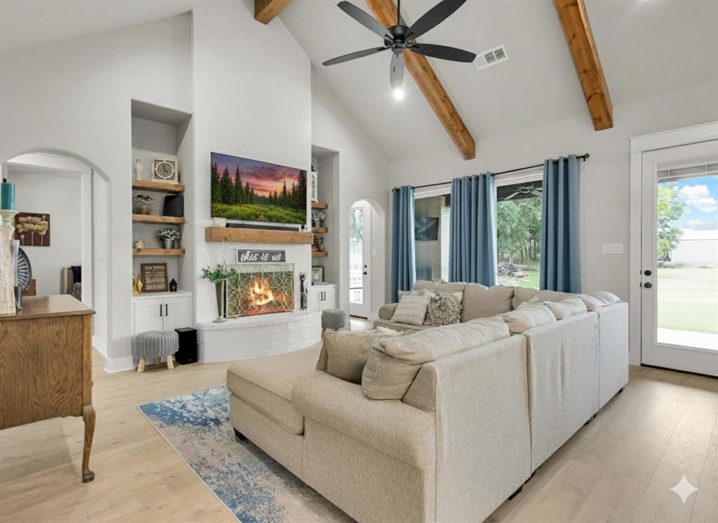 650 Winkler Way Springtown, TX 76082 - Photo 4 of 27 a living room with furniture and a flat screen tv