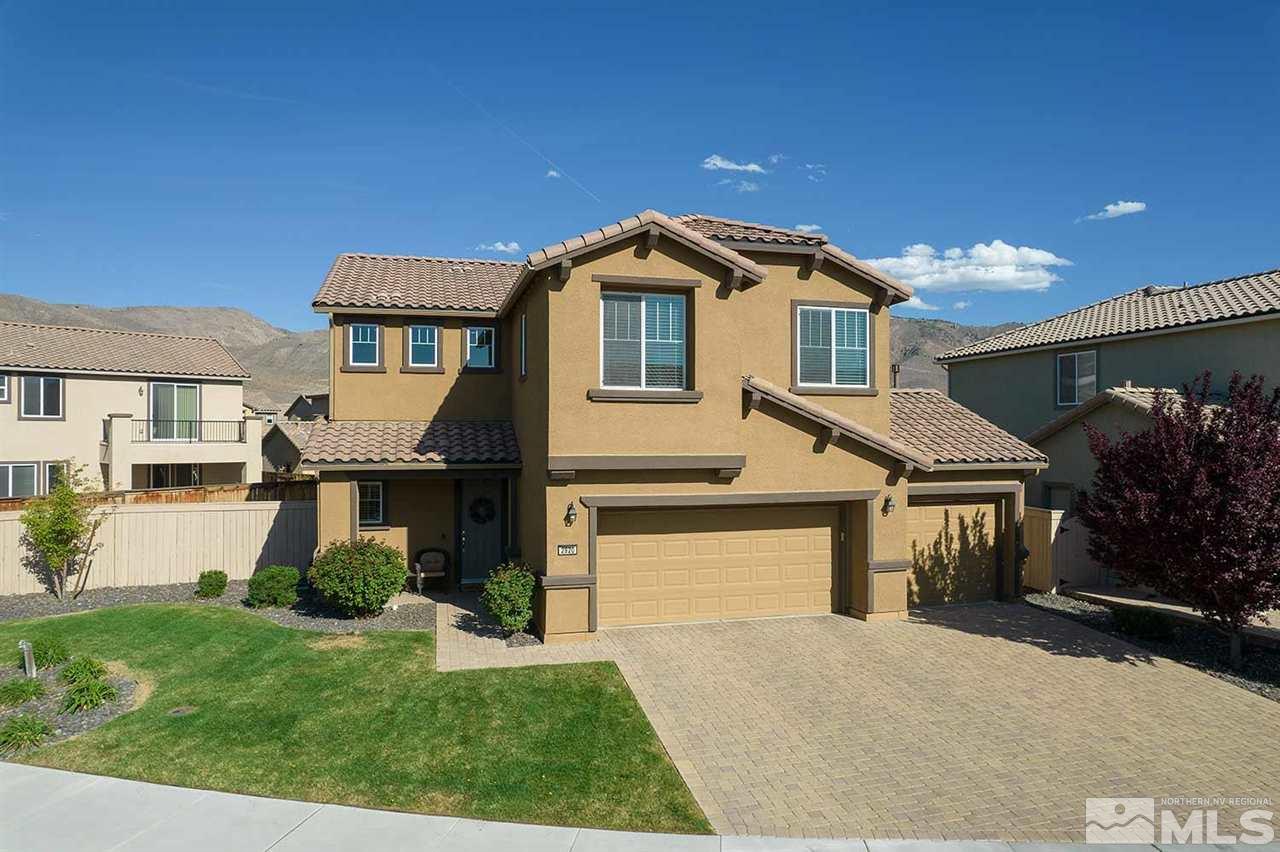 2820 Show Jumper Lane Reno, NV 89521 - Photo 1 of 40 a front view of a house with a yard and garage