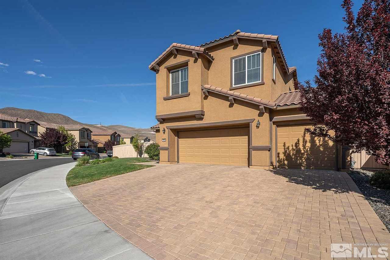 2820 Show Jumper Lane Reno, NV 89521 - Photo 15 of 40 a front view of a house with a yard and garage