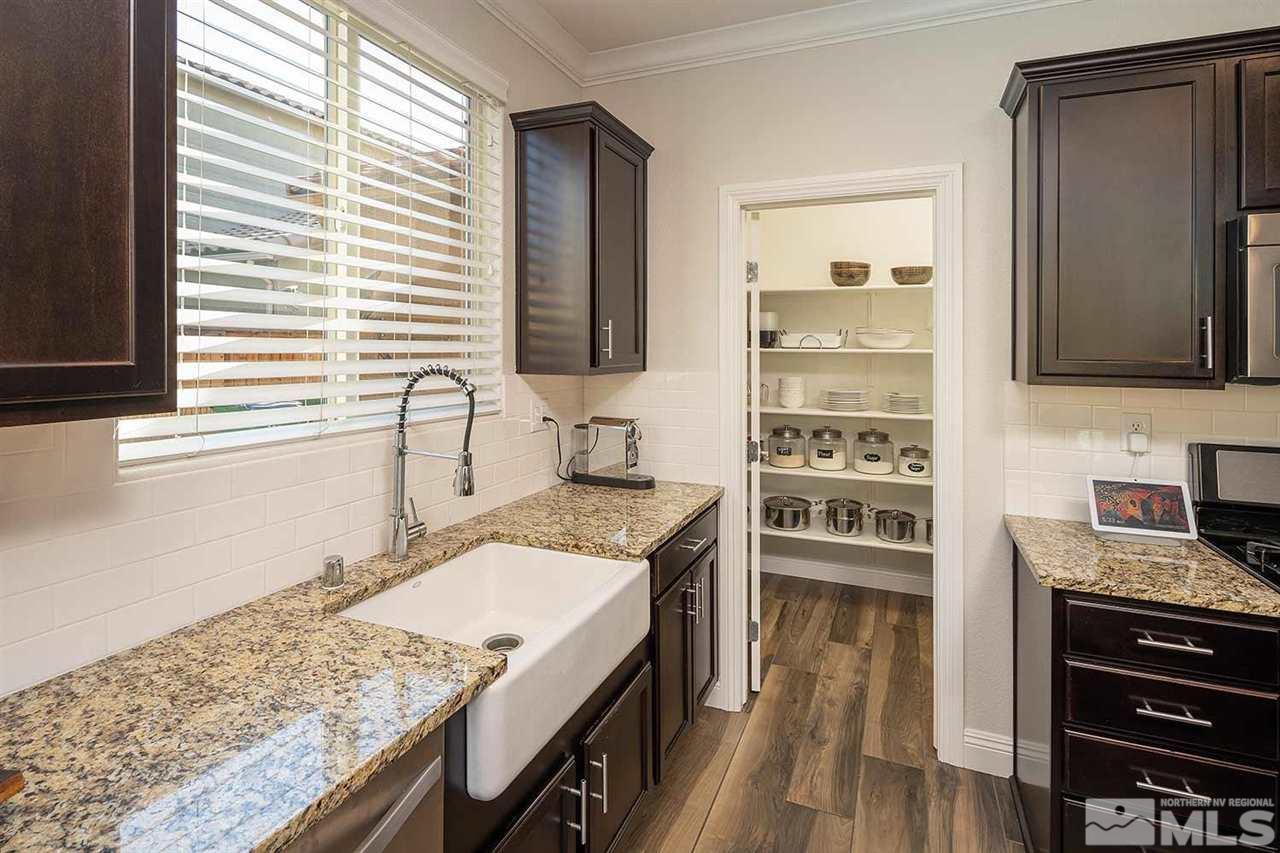 2820 Show Jumper Lane Reno, NV 89521 - Photo 18 of 40 a kitchen with a stove a sink and a refrigerator