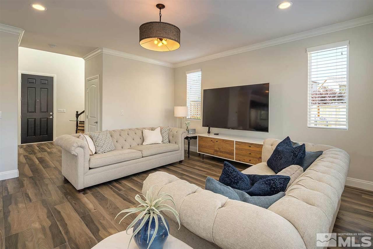 2820 Show Jumper Lane Reno, NV 89521 - Photo 20 of 40 a living room with furniture and a flat screen tv