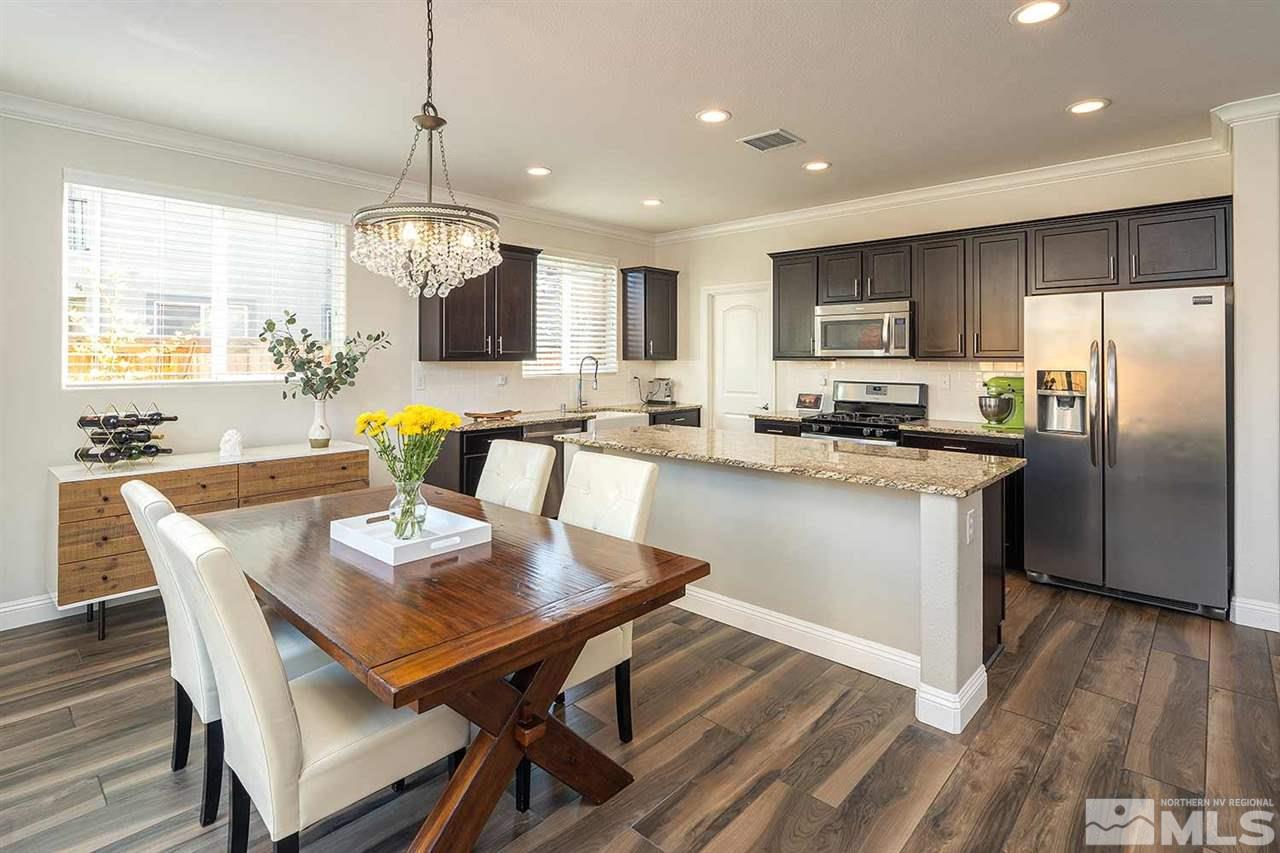 2820 Show Jumper Lane Reno, NV 89521 - Photo 2 of 40 a large kitchen with a table and chairs