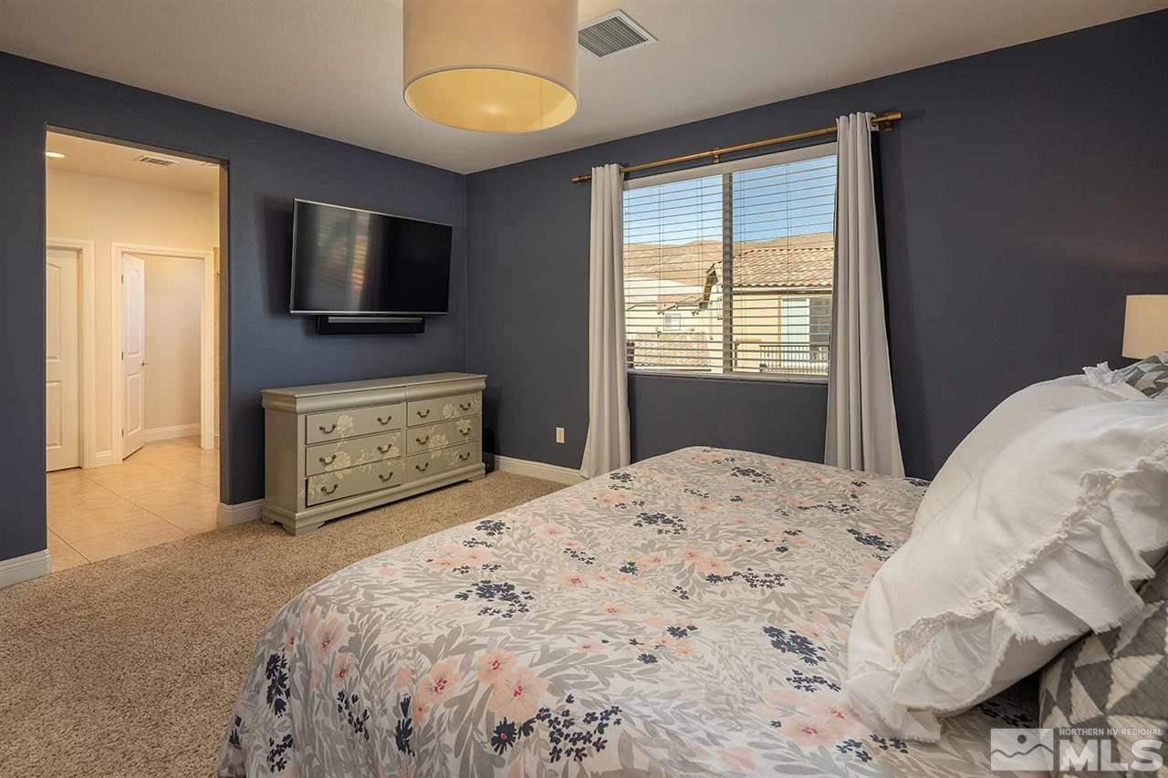 2820 Show Jumper Lane Reno, NV 89521 - Photo 23 of 40 a bedroom with a bed and a flat screen tv