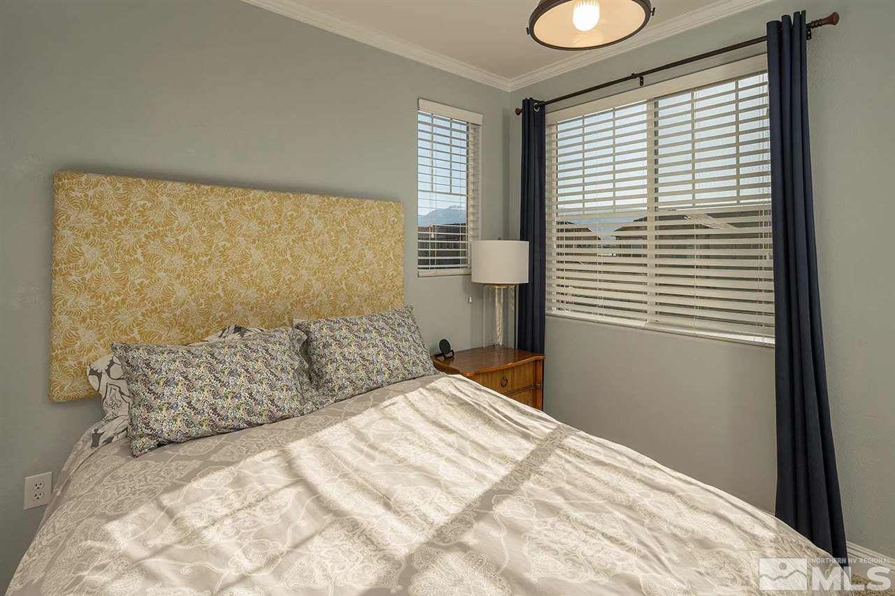 2820 Show Jumper Lane Reno, NV 89521 - Photo 25 of 40 a bedroom with a large bed and a window