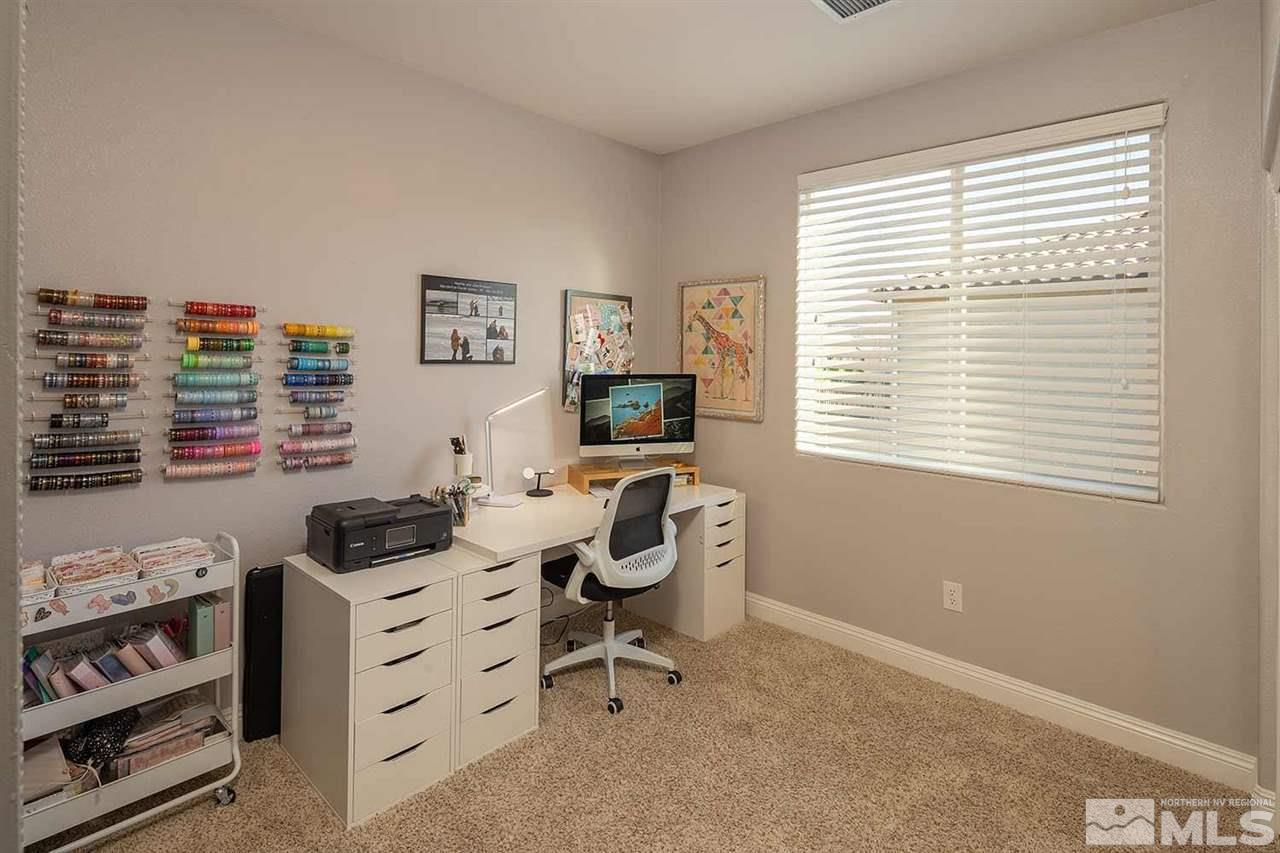 2820 Show Jumper Lane Reno, NV 89521 - Photo 26 of 40 a room with furniture a flat screen tv and a window