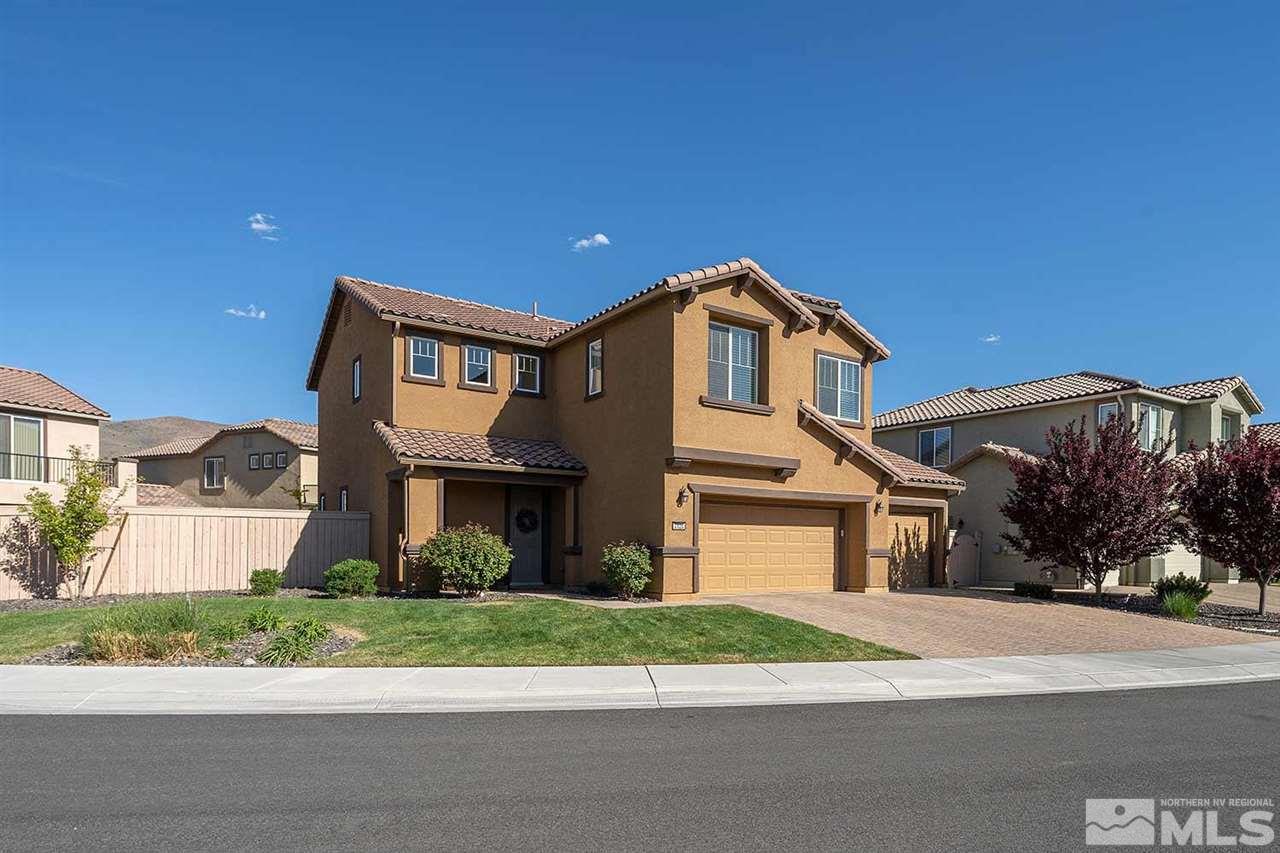 2820 Show Jumper Lane Reno, NV 89521 - Photo 29 of 40 a front view of a house with a yard and garage