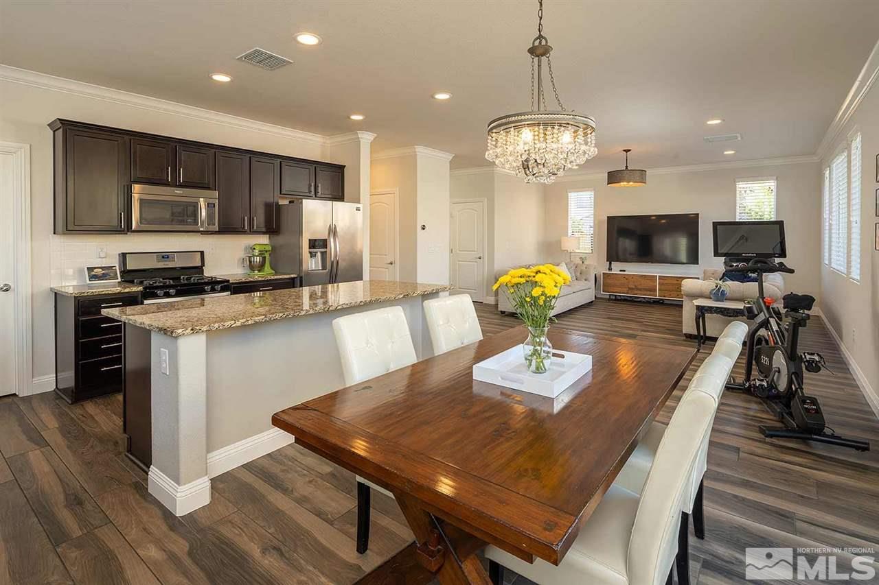 2820 Show Jumper Lane Reno, NV 89521 - Photo 32 of 40 a view of a dining room with furniture and wooden floor