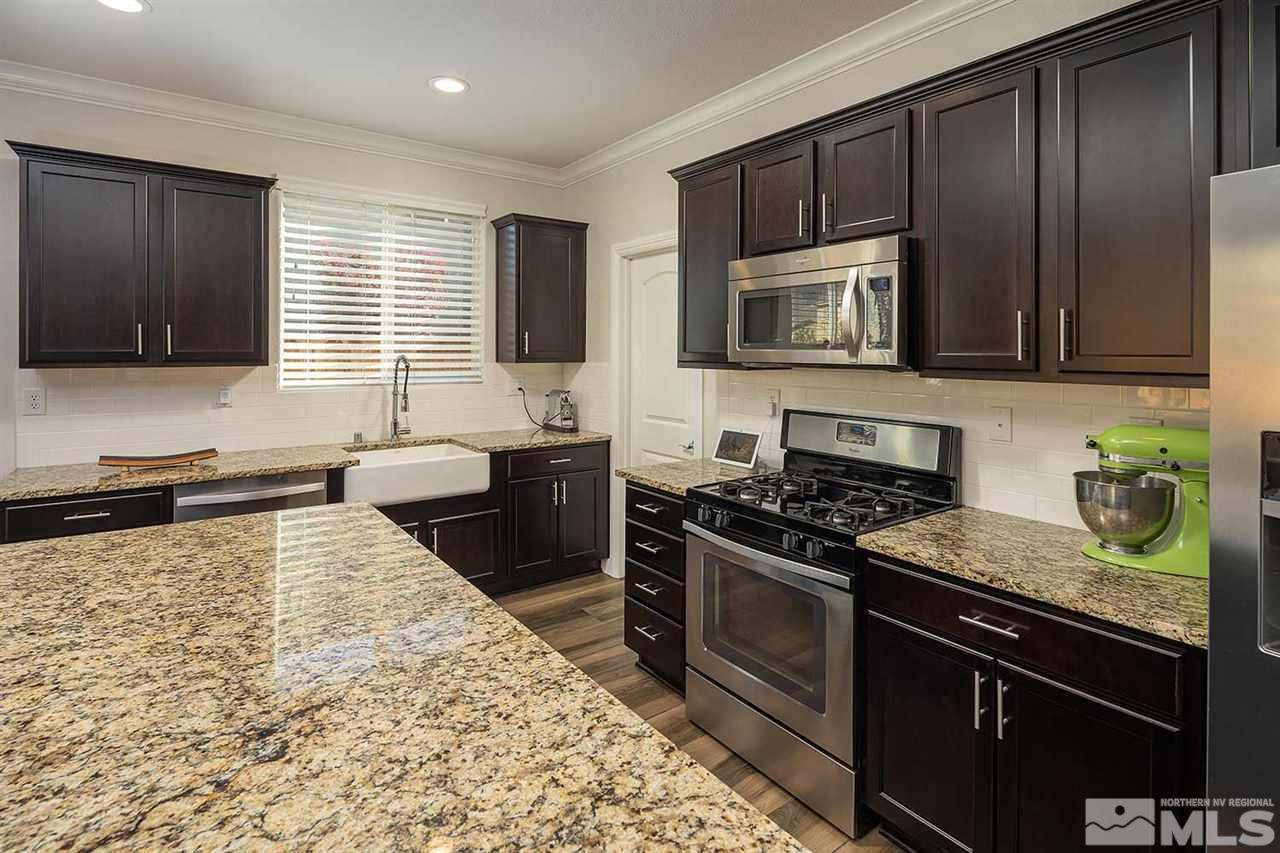 2820 Show Jumper Lane Reno, NV 89521 - Photo 33 of 40 a kitchen with a stove sink and microwave