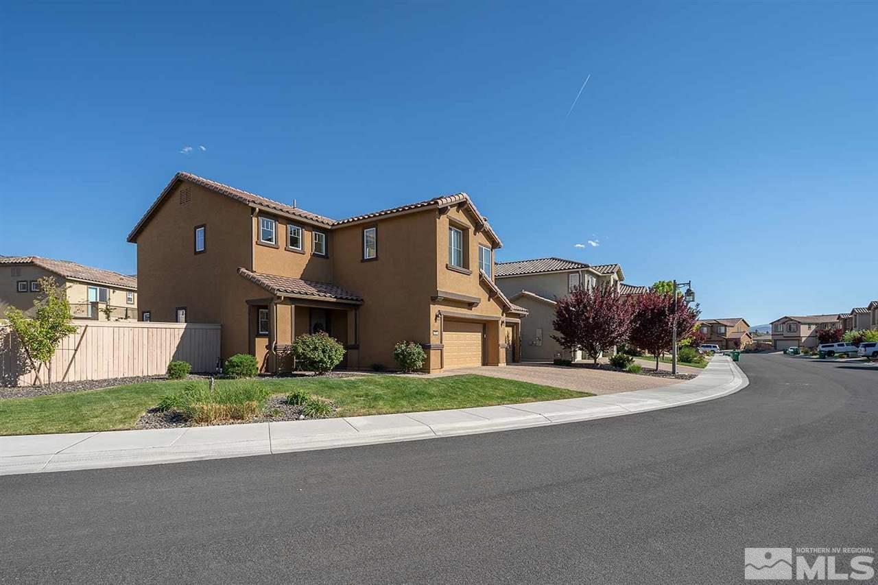 2820 Show Jumper Lane Reno, NV 89521 - Photo 40 of 40 a front view of a house with a yard and garage