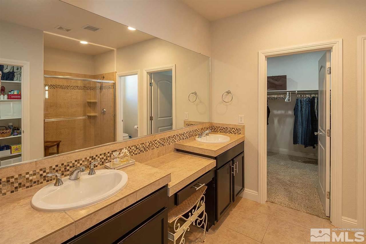 2820 Show Jumper Lane Reno, NV 89521 - Photo 6 of 40 a bathroom with a sink and a mirror
