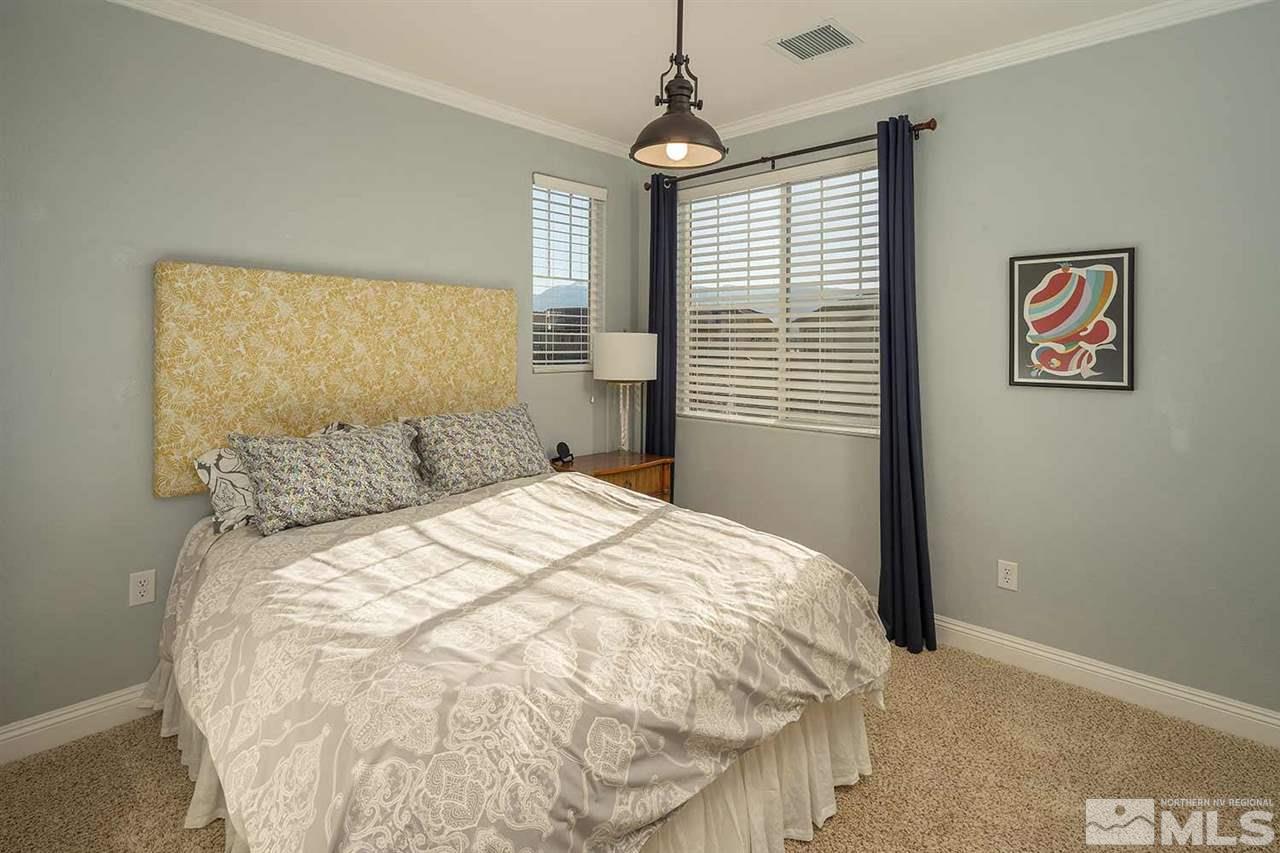 2820 Show Jumper Lane Reno, NV 89521 - Photo 7 of 40 a bedroom with a bed and a window