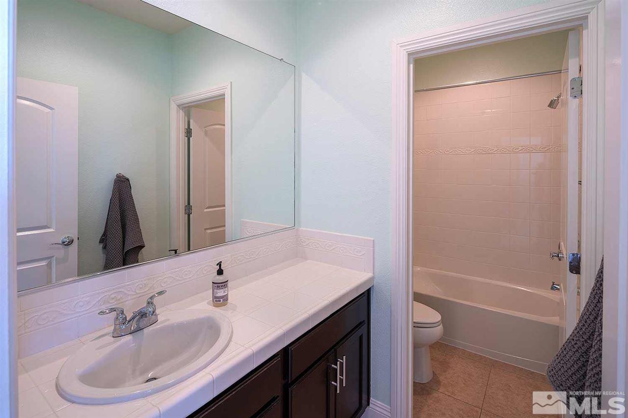 2820 Show Jumper Lane Reno, NV 89521 - Photo 8 of 40 a bathroom with a sink a toilet and shower