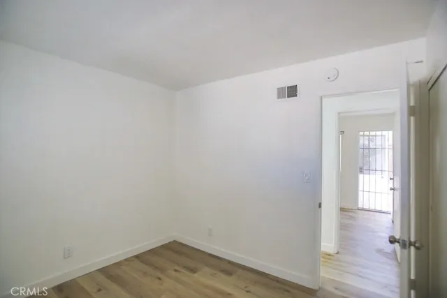 a bathroom with a sink vanity mirror and toilet