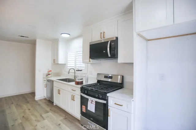 a kitchen with a stove and a microwave